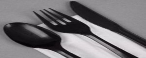 Disposable black plastic cutlery set with napkin